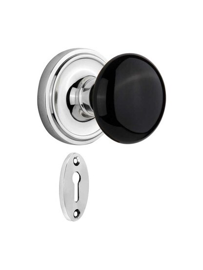 Classic Rosette Mortise-Lock Set with Black Porcelain Knobs in Polished Chrome.